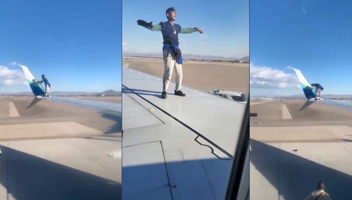 Un homme arrêté après avoir grimpé sur une aile d'avion avant le décollage